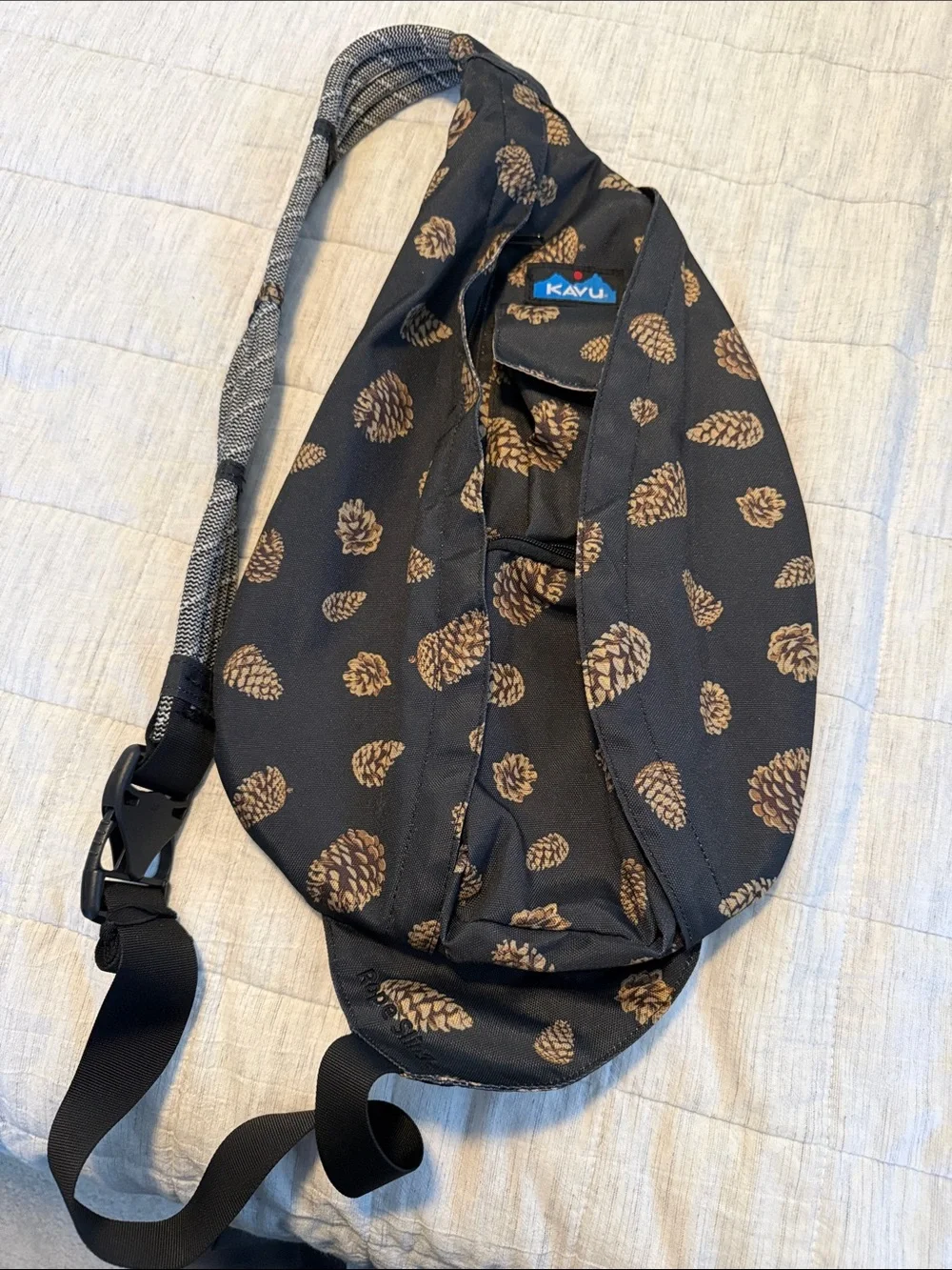 Kavu Black Sling Bag with Brown Pinecone Print